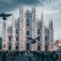 A panoramic view of Milan’s cityscape, featuring the iconic Milan Cathedral (Duomo di Milano) and the bustling streets filled with historic and modern architecture.